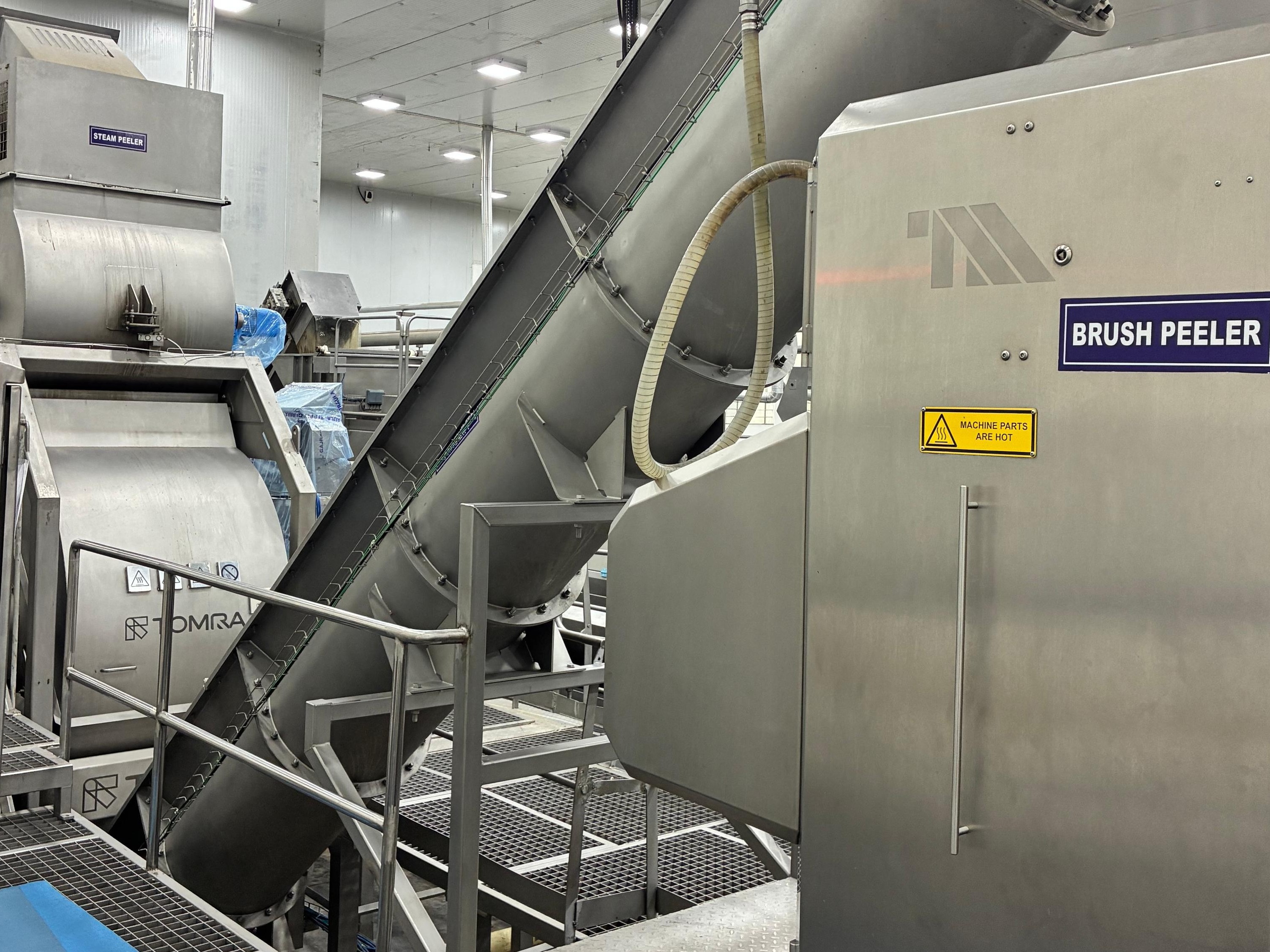Steam peeler and brush peeler equipment used in potato processing