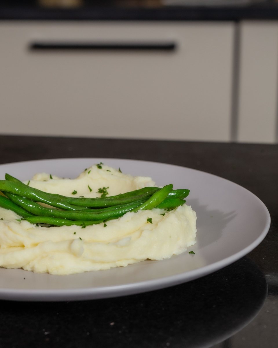 Bowl of mashed potatoes and a bowl of thick soup