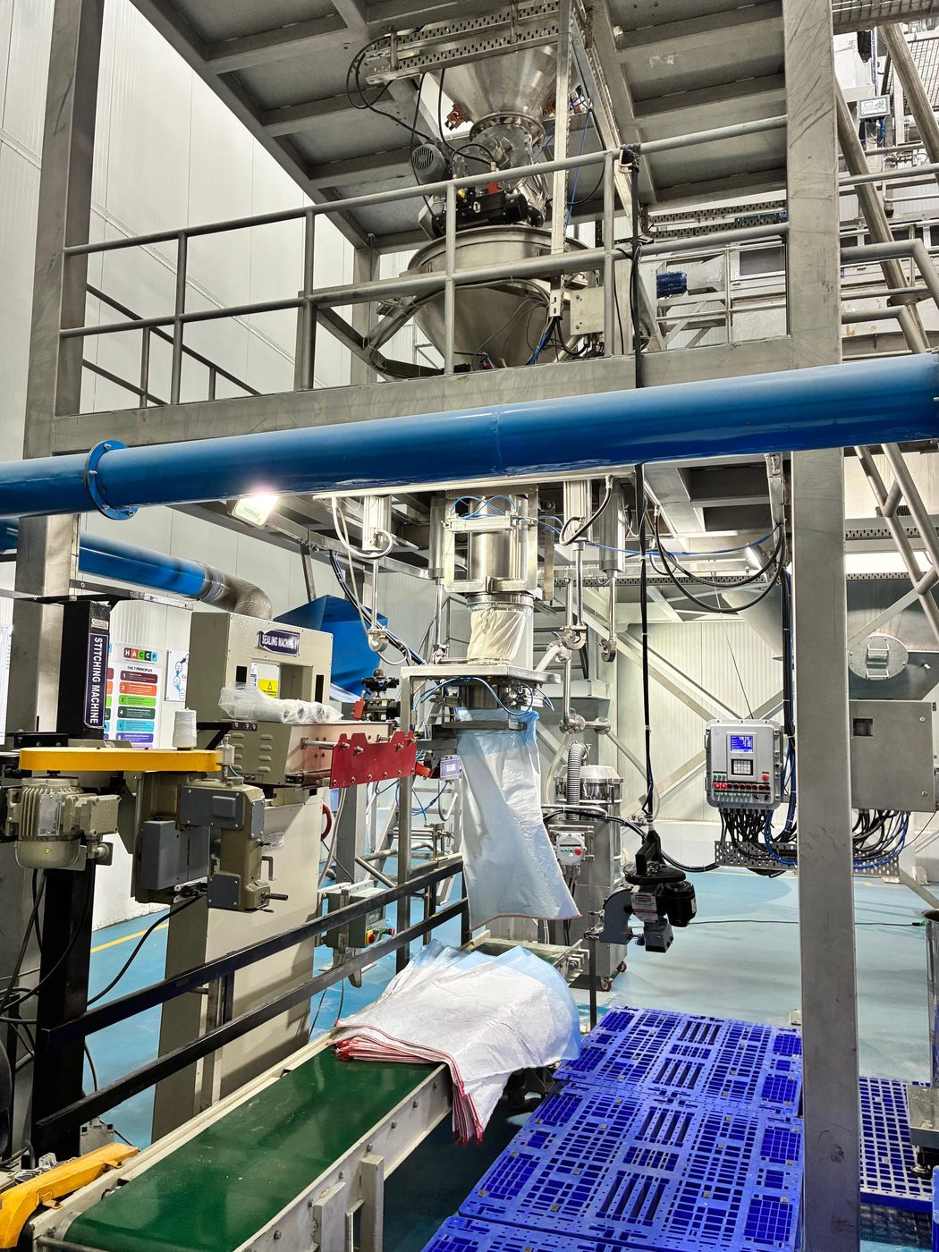 Automated bagging and stitching line packing Furaha Foods ingredients for dispatch